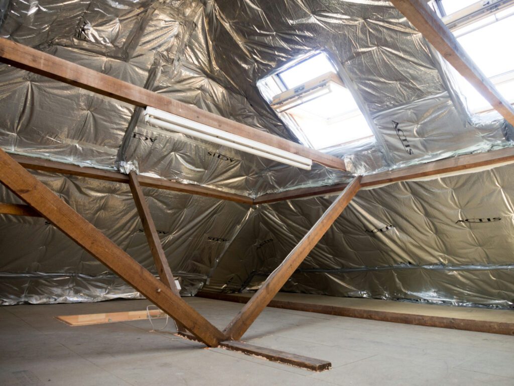 Loft insulation being laid between joists — does loft insulation improve EPC rating